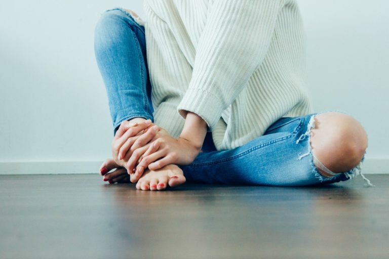 a person's feet on the floor
