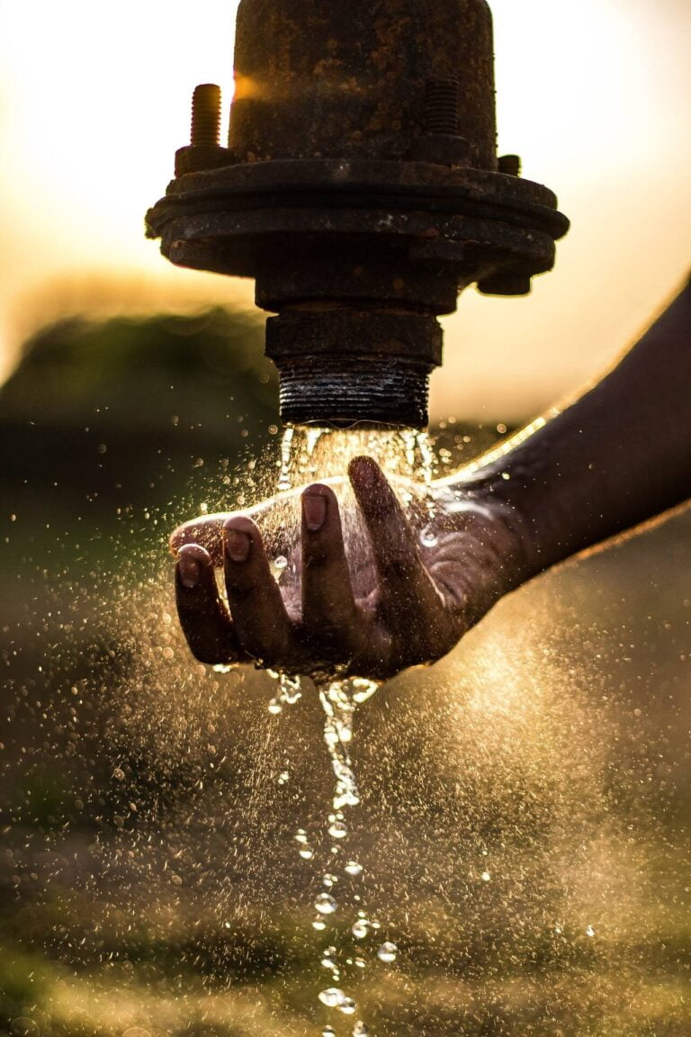 a close-up of a hand holding a metal piece