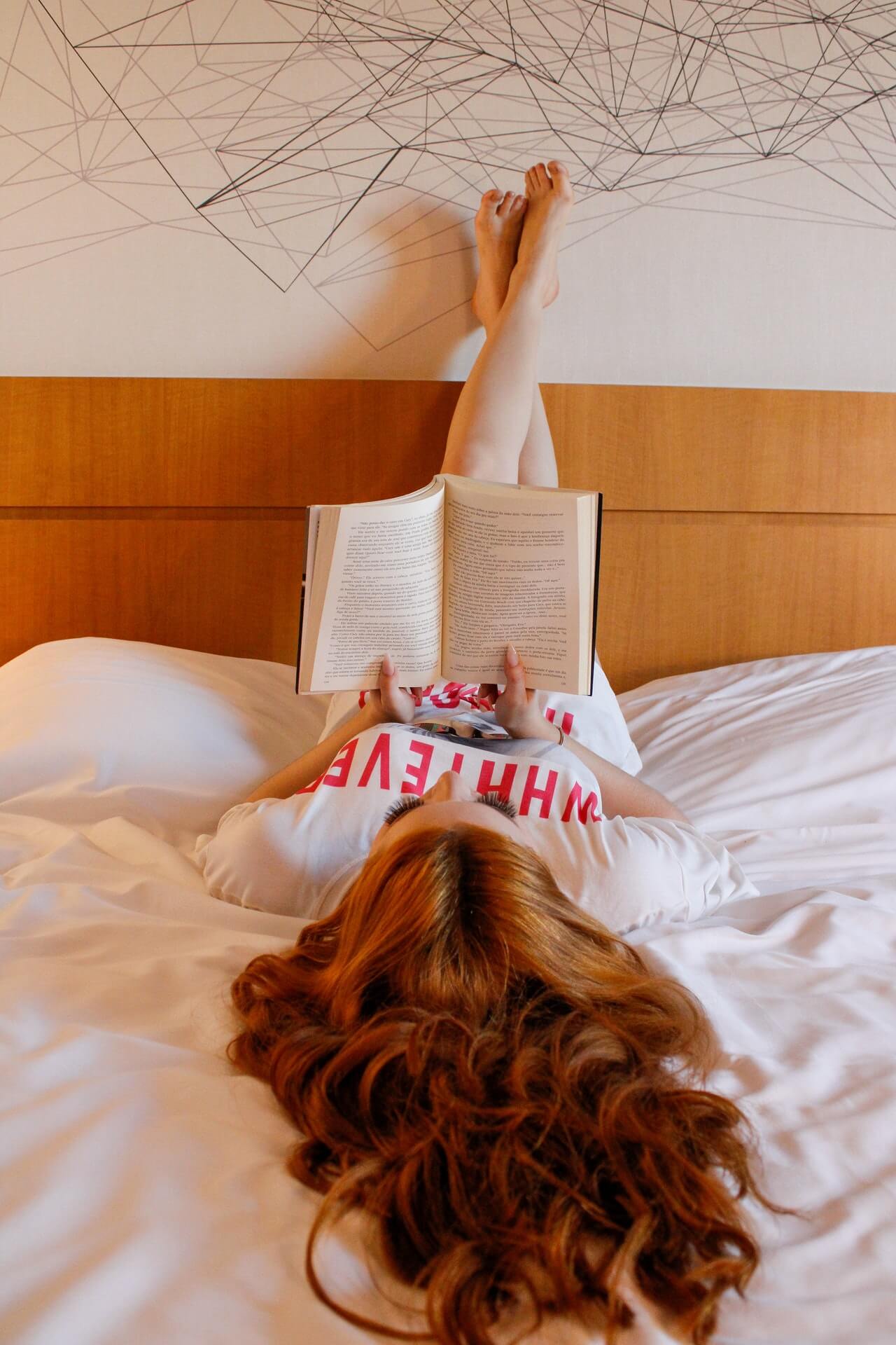 a bed with a pillow and a headboard